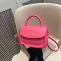 Fashionable bright pink PU saddle bag with gold lettering and adjustable shoulder strap - Pink