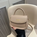 Beige faux leather saddle bag with top handle and gold lettering for women - Khaki