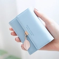 Light blue faux leather accordion card holder wallet with leaf pendant and snap closure - Light Blue