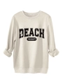 Detail van de BEACH THERAPY opdruk op het crèmekleurige sweatshirt met ronde hals - S / Zandkleur