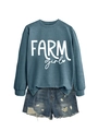Detail of Farm Girl sweatshirt paired with distressed denim shorts on white background - Blue (White Font)
