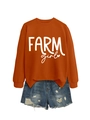 Flat lay of an orange Farm Girl sweatshirt paired with distressed denim shorts - Burnt Orange (White Font)