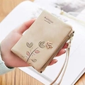 Short beige faux leather wallet for women with floral print and gold bird detail - Apricot