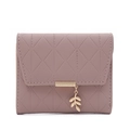 Detailed view of leaf charm and diamond quilted stitching on short mauve wallet - Dusty Pink