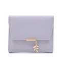 Detail of purple quilted wallet with golden leaf pendant and PRETTYZYS engraved bar - Light Purple