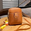 Brown litchi leather crossbody phone bag with adjustable strap and cute tiger charm - Brown