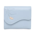 Detail of light blue tri-fold wallet featuring leaf embroidery and golden leaf charm - Blue