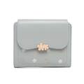 Close-up of a blue PU leather wallet featuring a gold floral buckle and floral patterns - Sky Blue