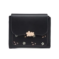 Detailed close-up of a black PU leather wallet with metallic flower charms and floral prints - Black