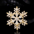 Elegant rotating snowflake brooch in gold with baguette-cut crystals and mirror reflection - Snowflake Brooch