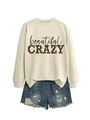 Flat lay of cream sweatshirt with leopard print text and distressed blue denim shorts - Sand (Black Letters)