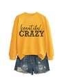 Flat lay of yellow sweatshirt with beautiful crazy print and distressed denim shorts - Yellow (Black Letters)