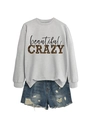 Flat lay of grey sweatshirt with leopard print CRAZY text and ripped denim shorts - Grey (Black Print)