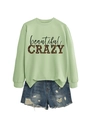 Detail of light green sweatshirt with leopard print CRAZY lettering and frayed denim shorts - Olive Green (Black Letters)