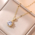 Elegant gold titanium necklace featuring a large round green emerald gemstone pendant - Gold/White Zirconia