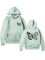 Détail d'un sweat à capuche vert clair avec motif papillon floral et poignets côtelés - Vert clair