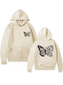 Détail du sweat à capuche beige montrant l'imprimé papillon et fleur recto verso - Sable