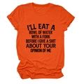 Detail of orange crew neck T-shirt featuring bold black typography and soft cotton texture - S / Orange (Black Text)