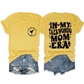 Detail view of yellow T-shirt with 'IN MY TAEKWONDO MOM ERA' retro print and denim shorts - Yellow (Black Font)