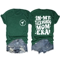 Detailed flat lay of dark green Taekwondo Mom Era T-shirt and distressed denim shorts - Vintage Green (White Font)