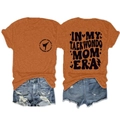Front and back view of caramel Taekwondo Mom Era graphic T-shirt with denim shorts - Burnt Orange (Black Font)
