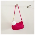 Detail of rose pink felt shoulder bag with V-shaped quilting and white fluffy pom-pom - Rose Red