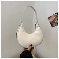 Detail of a white minimalist hobo shoulder bag featuring smooth leather and silver hardware - White