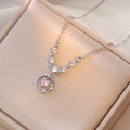 Pink heart zircon and silver crescent moon pendant necklace on a gold jewelry box - Star Moon Heart Steel Color