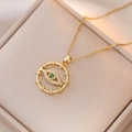 Gold Bohemian evil eye necklace with green stone and white zircon on elegant jewelry box - Cross Chain Evil Eye / Gold