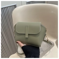 Detail of sage green PU leather crossbody bag with white stitching and gold hardware - Bean Green