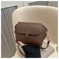 Detail view of dark brown vintage crossbody bag with matte faux leather and gold D-rings - Brown