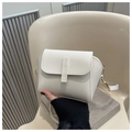 Detailed close-up of white PU leather crossbody bag with flap and gold metal hardware - Off White