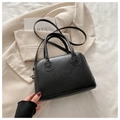 Minimalist black Boston handbag with embossed texture and adjustable shoulder strap - Black