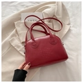 Retro Boston handbag in deep burgundy red finish with textured embossed lettering - Red
