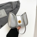 Sparkling silver sequin crescent shoulder bag with golden round twist lock and metallic finish - Silver