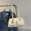Retro cream-white bowling bag with front flap pockets and a silver bow charm - White