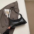 Retro black PU leather underarm bag with silver studs on brown blazer background - Black