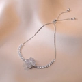 Detail of adjustable clover bracelet with pink pave stones and sparkling zircons - Steel Pink Rotating Heart Bracelet (TS0264)
