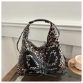 Leopard print crossbody bag detail with black heart patch and cross-lace design - Khaki