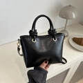 Detail of black matte leather crossbody bag with FASHION lettering and gold hardware - Black