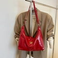 Red glossy leather hobo shoulder bag with a gold triangle buckle on an outfit - Red (No Pendant)