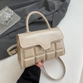 Beige shoulder bag with chocolate pattern texture and elegant gold-tone hardware - Khaki