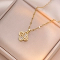 Golden clover zircon pendant necklace with Amour engraving on elegant velvet display - Gold Four Leaf Clover Amour Engraved Style (X0882)