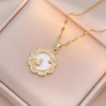 Close-up of rabbit shell necklace with sparkling cubic zirconia on beige silk background - Rabbit Style (X0942) / Gold