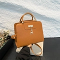 Brown crocodile pattern handbag with metal deer pendant and adjustable strap - Tan