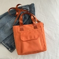 Große orangefarbene Nylon-Einkaufstasche mit Vordertasche und verstellbarem Schultergurt - Orange