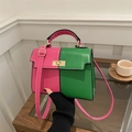 Bolso Kelly chic en cuero fucsia y verde bicolor con cierre dorado giratorio - Rosa Verde Contraste