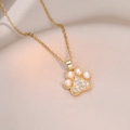Golden cat paw pendant necklace with freshwater pearls and sparkling zircons on satin - Cat Paw Freshwater Pearl Necklace (X1244)