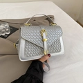 Silver woven crossbody bag for women with golden buckle and modern metallic finish - Silver