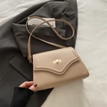 Minimalist beige leather shoulder bag with gold oval twist lock and slim strap - Khaki